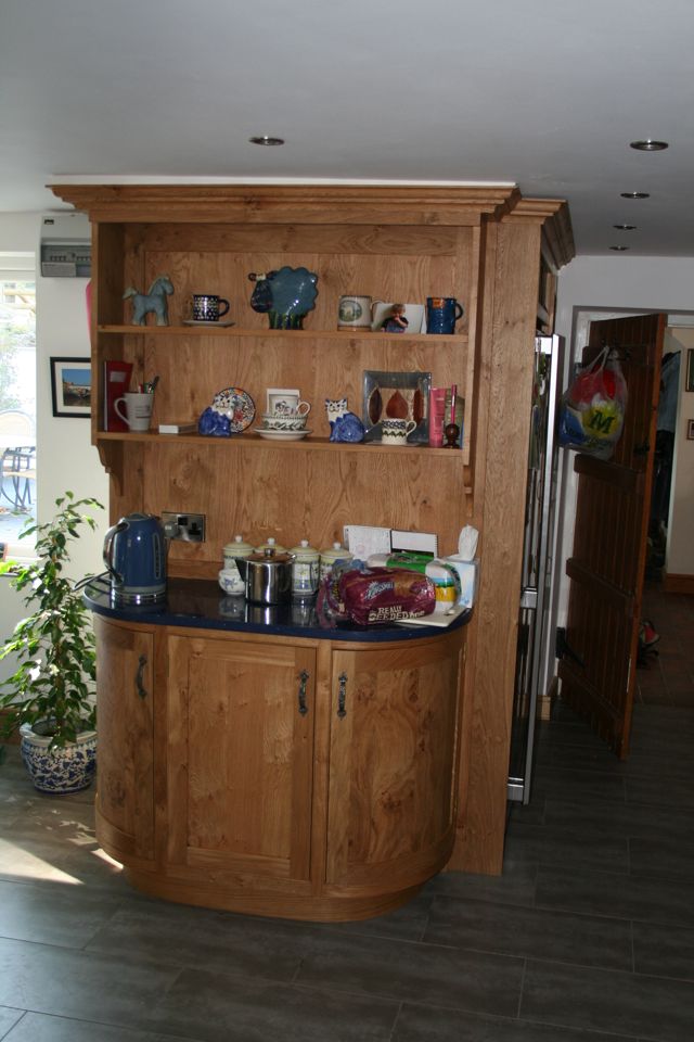 Curved dresser unit with open shelving above